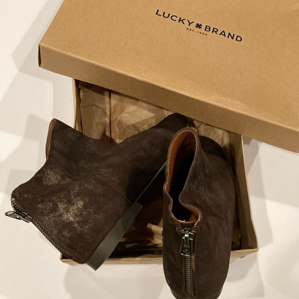 Lucky Brand ankle boots, slim fit with brown tones to complement any style.